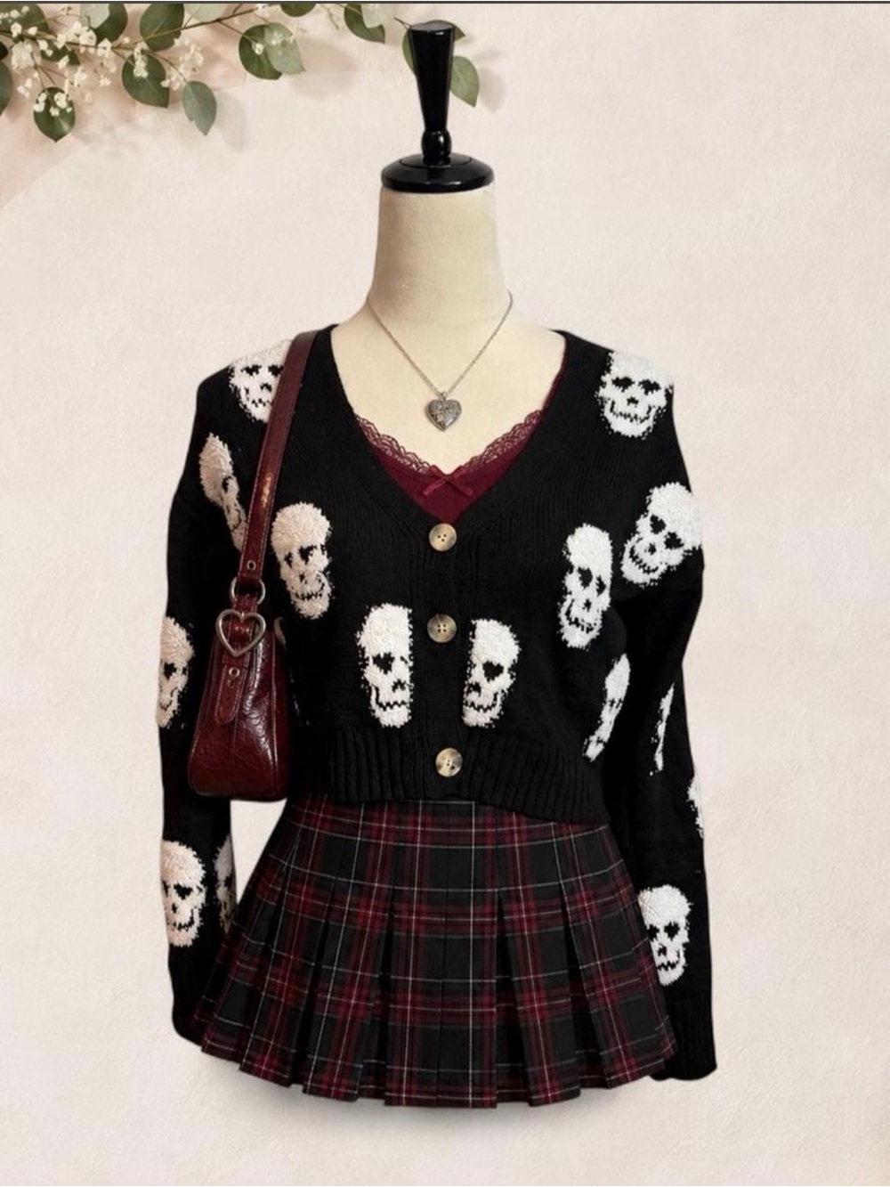 Almost Famous Black Skull V‑Neck Button Cardigan with White Skull Pattern